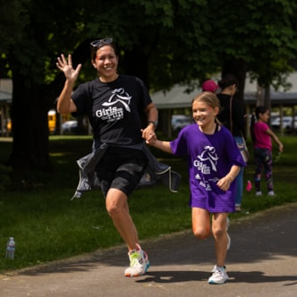 Girls on the Run coach runs with program participant 