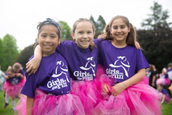 Three Girls on the Run participants smiling in pink tutus